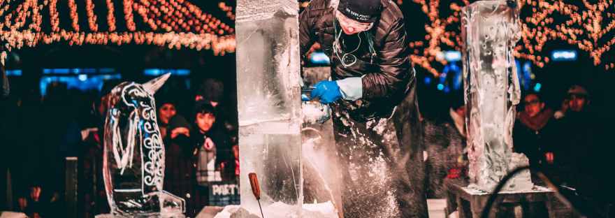 Man creating a winter ice sculpture.